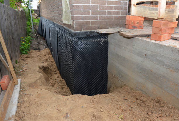 SJ Waterproofing Pros technician performing targeted Waterproofing assessment in Glen Burnie, MD